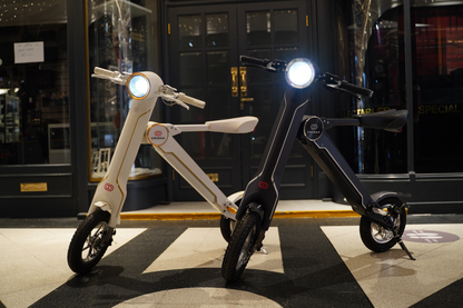 Start2Finish Cruzaa PRO electric scooter in racing white with Bluetooth speakers, USB port, 45km range, and 35km/h top speed.