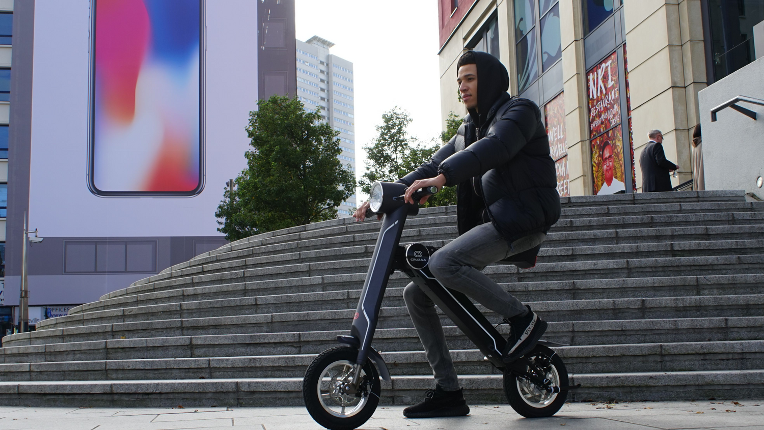 Start2Finish Cruzaa electric scooter in Magno Green with Bluetooth speakers, USB port, 45km range, and 35km/h top speed.
