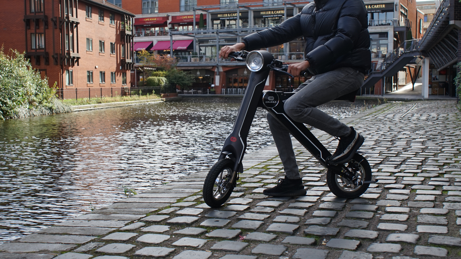 Start2Finish Cruzaa electric scooter with Bluetooth speakers, USB port, 35km range, and 25km/h top speed, shown in image.