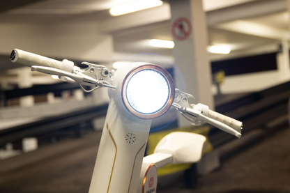 Start2Finish Cruzaa PRO electric scooter in racing white with Bluetooth speakers, USB port, 25km/h top speed, and 35km range.