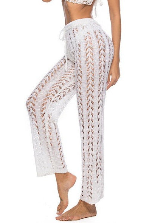 Jade Icarus knit cover-up pants in automotive style, featuring a textured knit fabric and relaxed fit, displayed on a model.