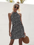 Automotive halter tie-back dress by Jade Icarus featuring sleek design, with visible straps and fabric details.