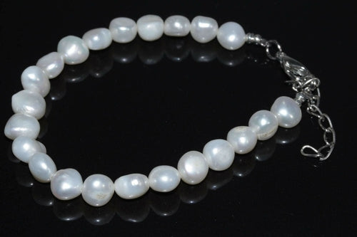 Elegant Silver Hestia cultured freshwater pearls bracelet featuring round lustrous pearls on a delicate chain.