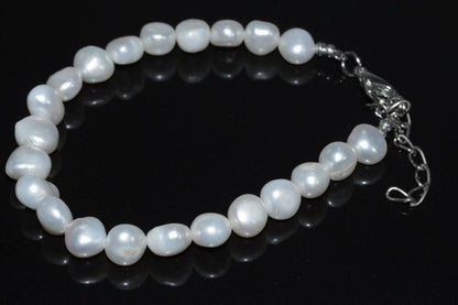 Elegant Silver Hestia cultured freshwater pearls bracelet featuring round lustrous pearls on a delicate chain.