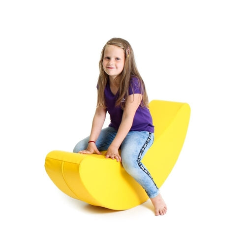 Blush Apricot banana-shaped furniture piece with smooth surface and vibrant yellow color, designed for modern home decor.