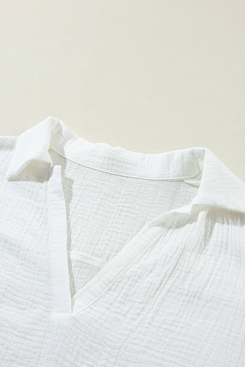 White crinkled lace splicing sleeve collared V-neck blouse by Carmine Juneberry, featuring delicate lace details and a stylish collar.