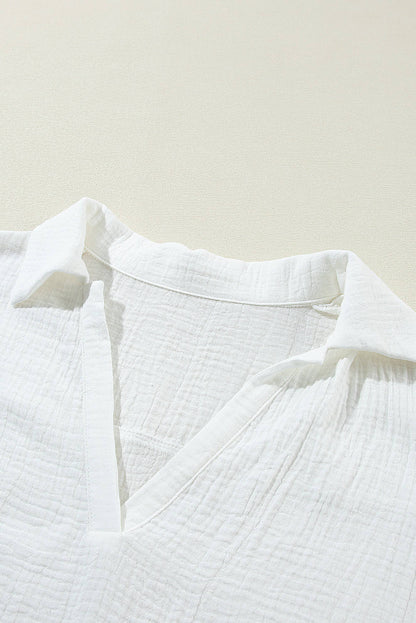 White crinkled lace splicing sleeve collared V-neck blouse by Carmine Juneberry, featuring delicate lace details and a stylish collar.