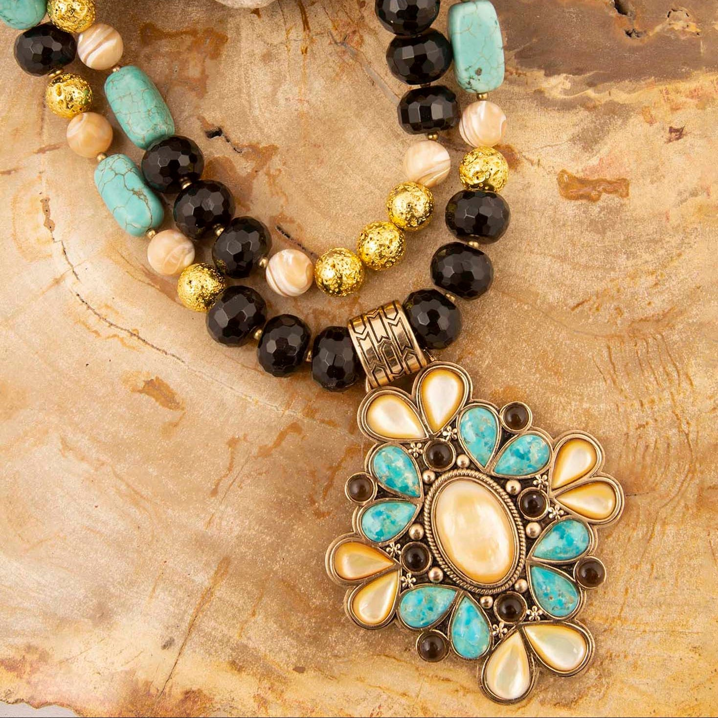 Start2Finish Barcelona blue turquoise and caramel mother of pearl gold pendant necklace with intricate jewelry design.