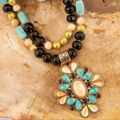 Start2Finish Barcelona blue turquoise and caramel mother of pearl gold pendant necklace with intricate jewelry design.