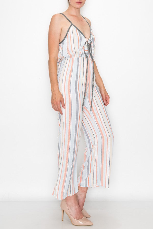 Orange front tie cropped jumpsuit by Yellow Hera, stylish clothing with a fitted waist and cropped length, displayed on a hanger.