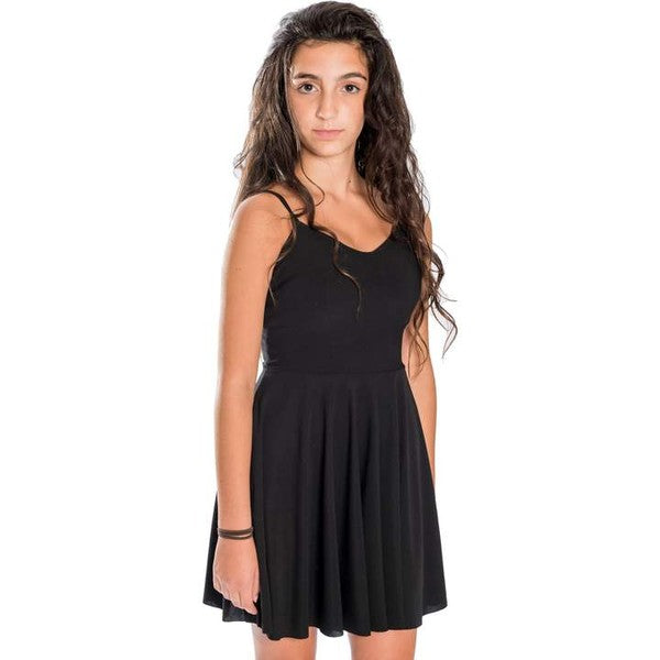 Girl wearing Jade Icarus girls cage back skater dress with a fitted bodice and flared skirt, perfect for casual outings.