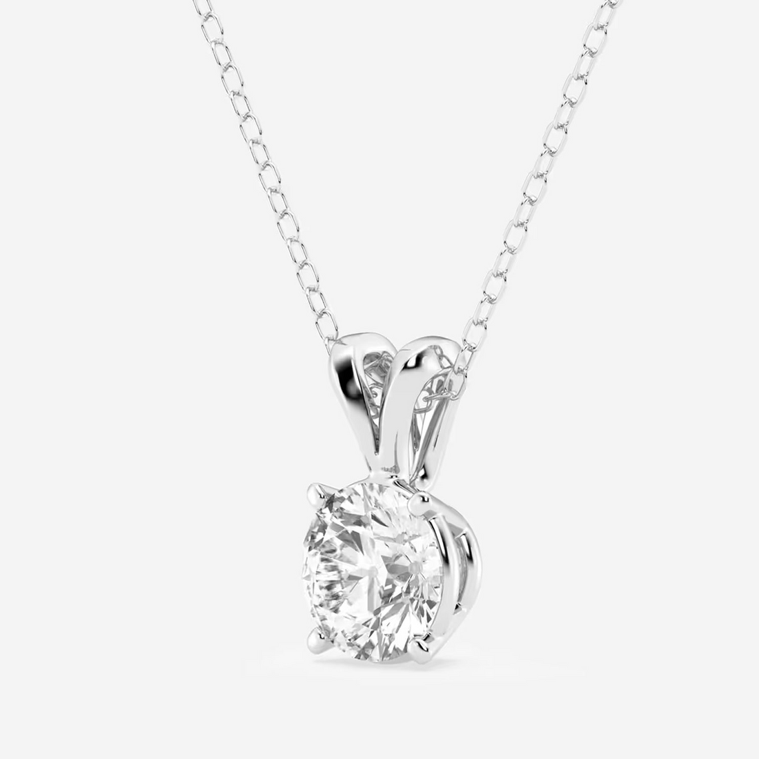 Round lab grown diamond solitaire pendant with split bail in 14K white gold over sterling silver.