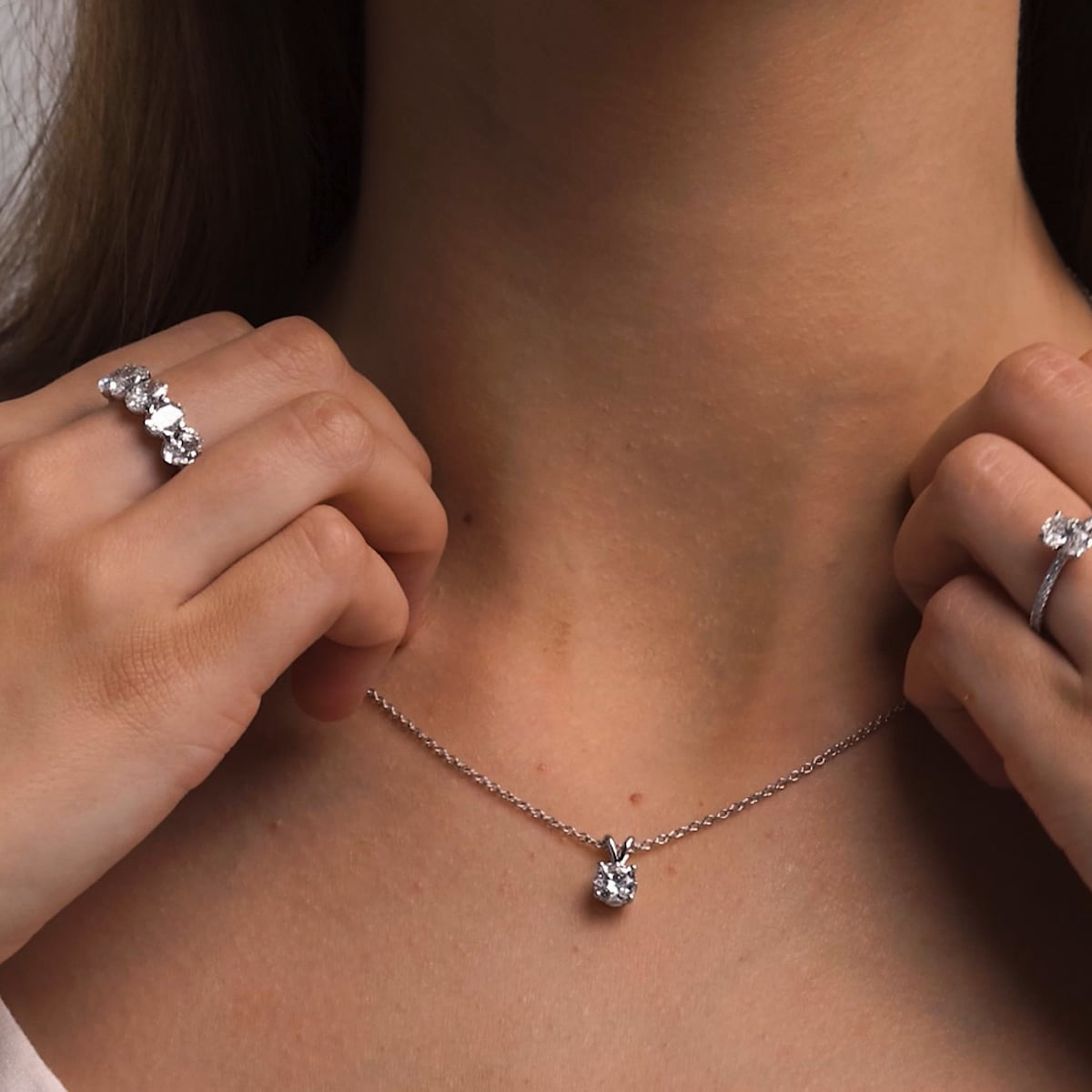 Round lab-grown diamond split bail solitaire pendant in 14K white gold over sterling silver with 0.75 CTW diamond.