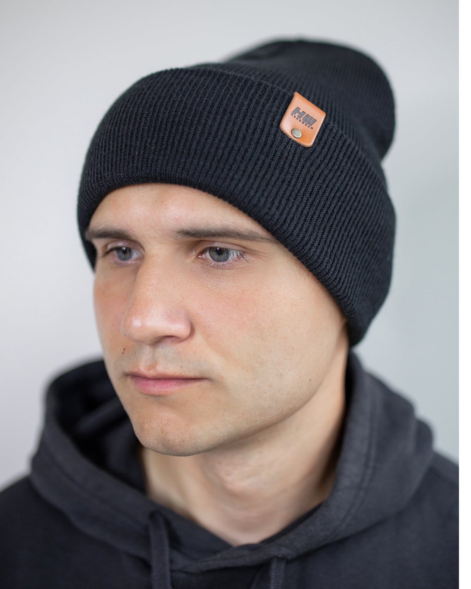 Azure Arrowwood HAAKWEAR Knit Cuffed Beanie in Dune Beige, showing a cozy, ribbed knit hat with a folded cuff and neutral color.