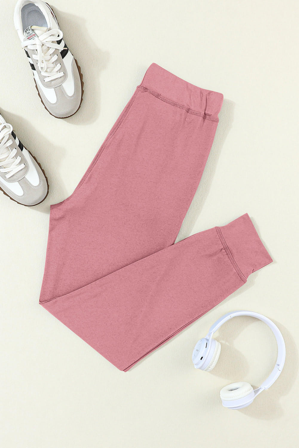 Carmine Juneberry fuchsia joggers with drawstring waist and side pockets, designed for activewear and comfortable movement.