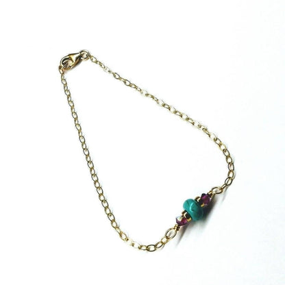14K gold filled pink and turquoise gemstone dainty bracelet with delicate chain and gemstone accents.