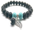 Black and turquoise feather charm lava stone essential oil bracelet featuring beads and charm, jewelry by Start2Finish.
