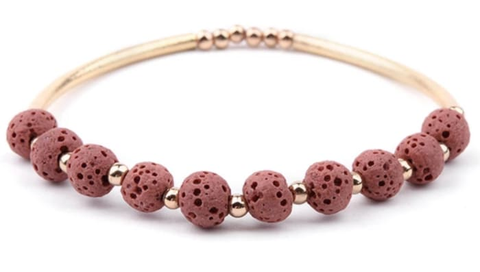 Rose lava stone and gold essential oil bracelet featuring round lava stones and gold accents, stylish jewelry accessory.