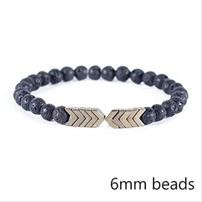 Brass yellow moonstone, arrow-shaped, lava stone beads bracelet featuring vibrant yellow moonstone and natural lava stones.