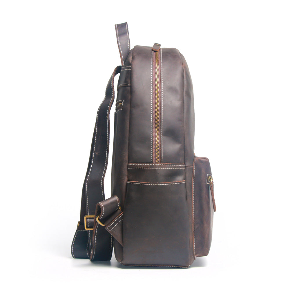 Handcrafted leather Calder Backpack by Start2Finish, showing its durable brown leather exterior and adjustable shoulder straps.