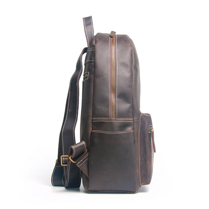 Handcrafted leather Calder Backpack by Start2Finish, showing its durable brown leather exterior and adjustable shoulder straps.