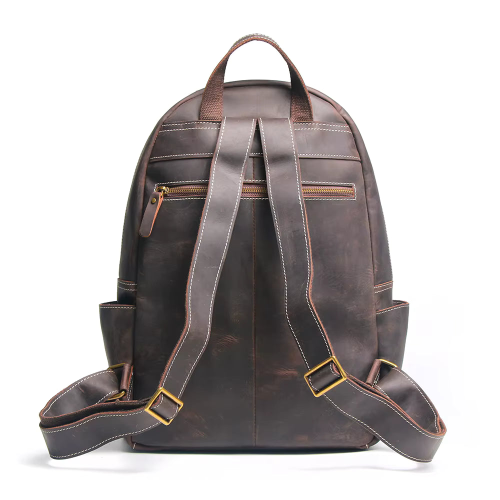 Handcrafted leather Calder Backpack by Start2Finish with adjustable straps and multiple compartments, showcasing fine leather craftsmanship.