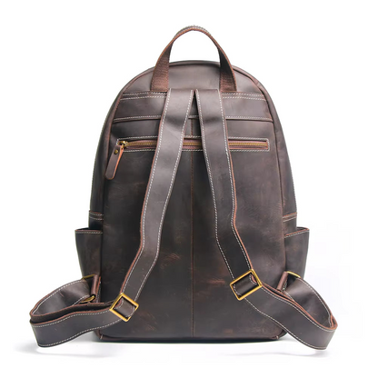Handcrafted leather Calder Backpack by Start2Finish with adjustable straps and multiple compartments, showcasing fine leather craftsmanship.