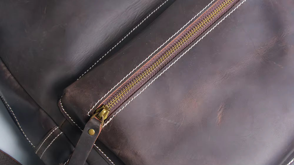 Handcrafted leather Calder Backpack by Start2Finish, showing its stylish design and durable straps in natural light.