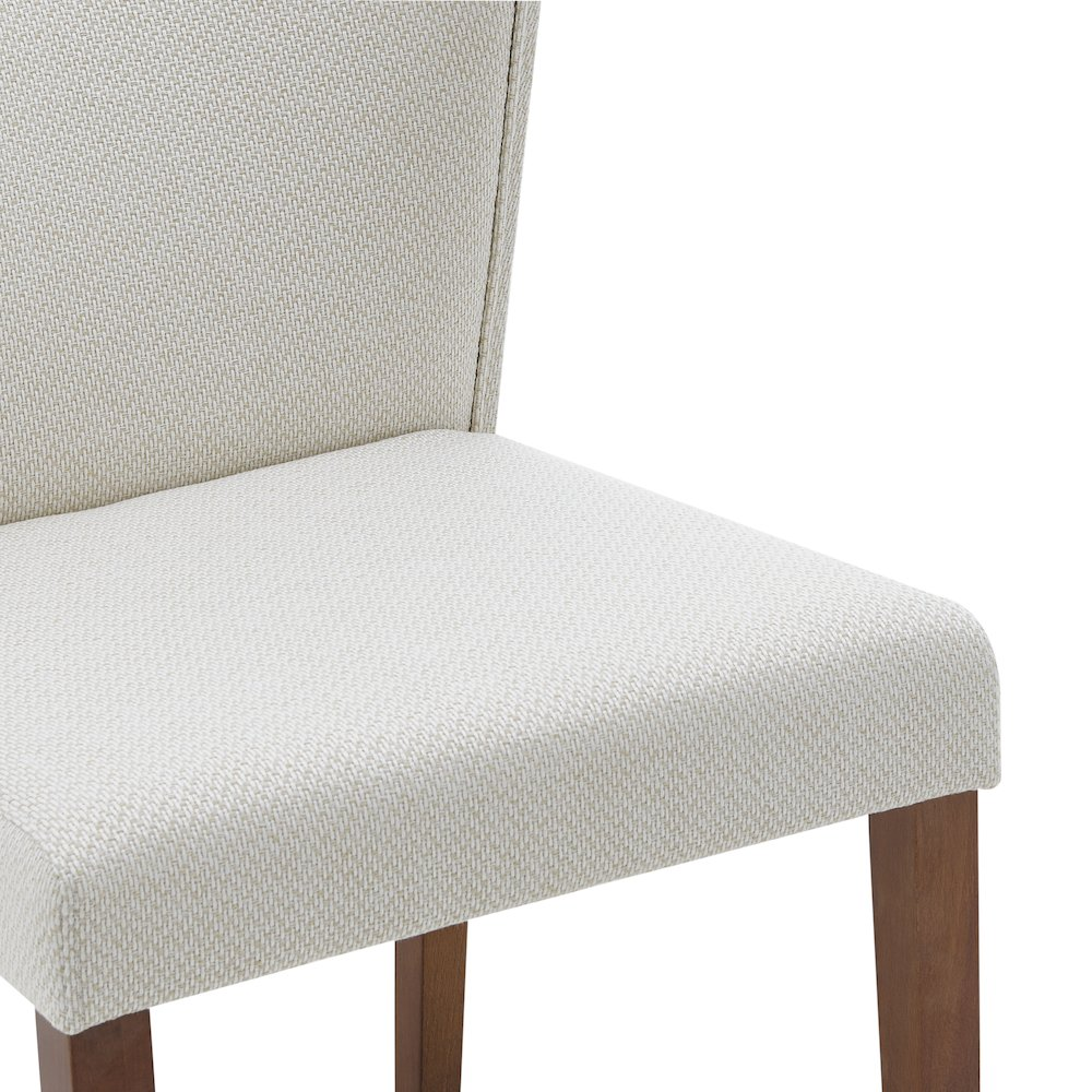 Two Start2Finish Albie fabric dining side chairs with wooden legs, featuring cushioned seats and backrests for comfortable dining.