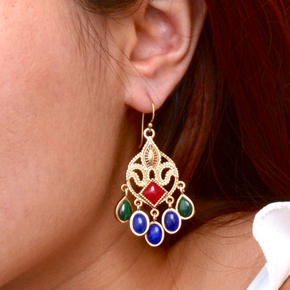Luscious red quartz golden chandelier earrings with intricate design, featuring dangling red gemstone beads and gold accents.