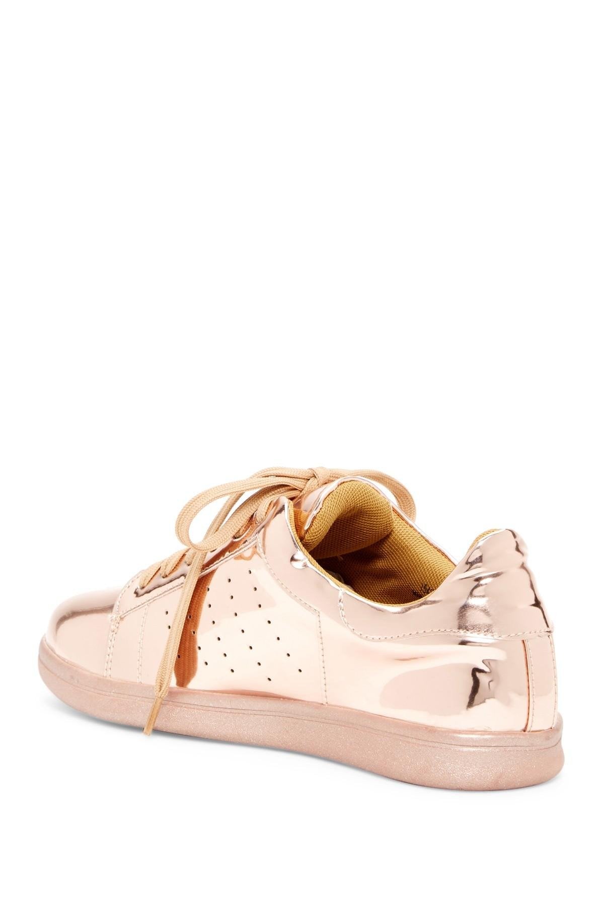 Azure Ophion rose gold footwear with stylish design and textured material, shown from a side angle.