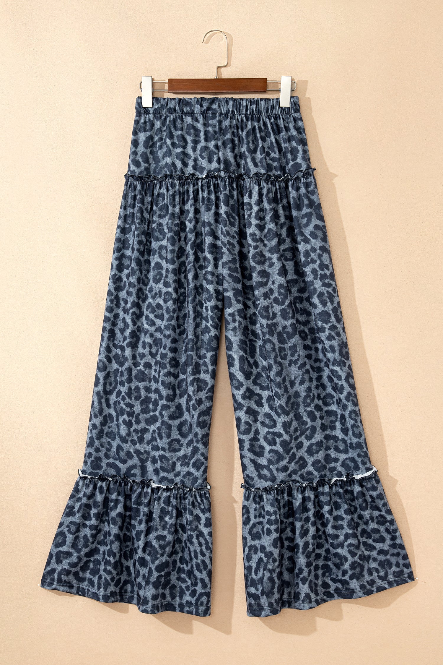 Leopard print wide-leg pants with frilled drawstring waist for women by Byzantium Bay, showcasing stylish and comfortable fashion.