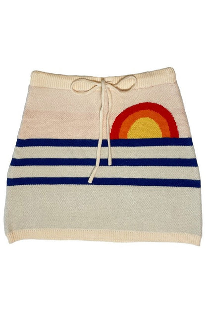 Jade Icarus Sunset knit skirt with vibrant sunset colors, showcasing a stylish, fitted knit design perfect for casual wear.