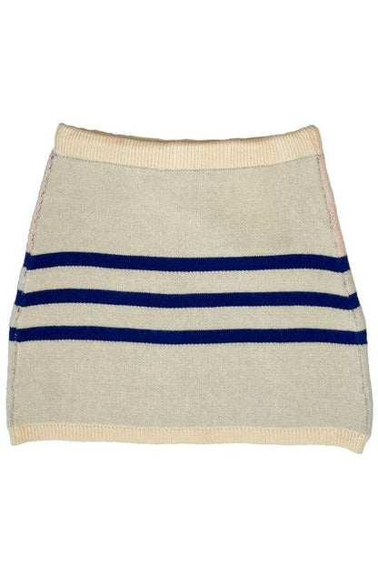 Sunset knit skirt by Jade Icarus, featuring a vibrant, colorful design with a flowing, textured fabric.