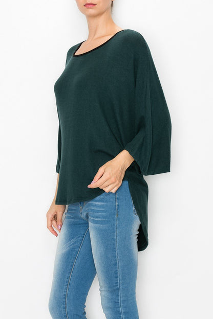 Green high and low round neck tunic top by Yellow Hera, shown as a stylish dress with flowing fabric and relaxed fit.