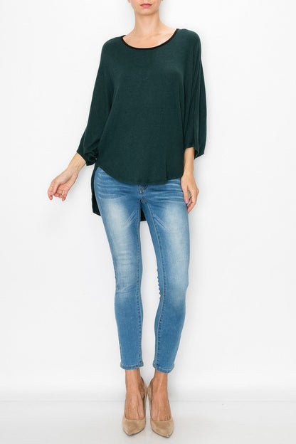 Green high and low round neck tunic top by Yellow Hera, displayed as a stylish dress, with a flowing, asymmetrical hem.