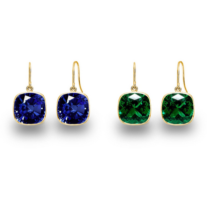 Pair of drop earrings with 9.00 CTW cushion cut blue sapphire and emerald gemstones in sterling silver or gold-plated silver.
