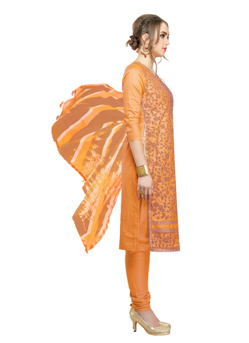 Orange cotton salwar material for women from Ivory Cassiopeia, featuring traditional fabric and detailed design.