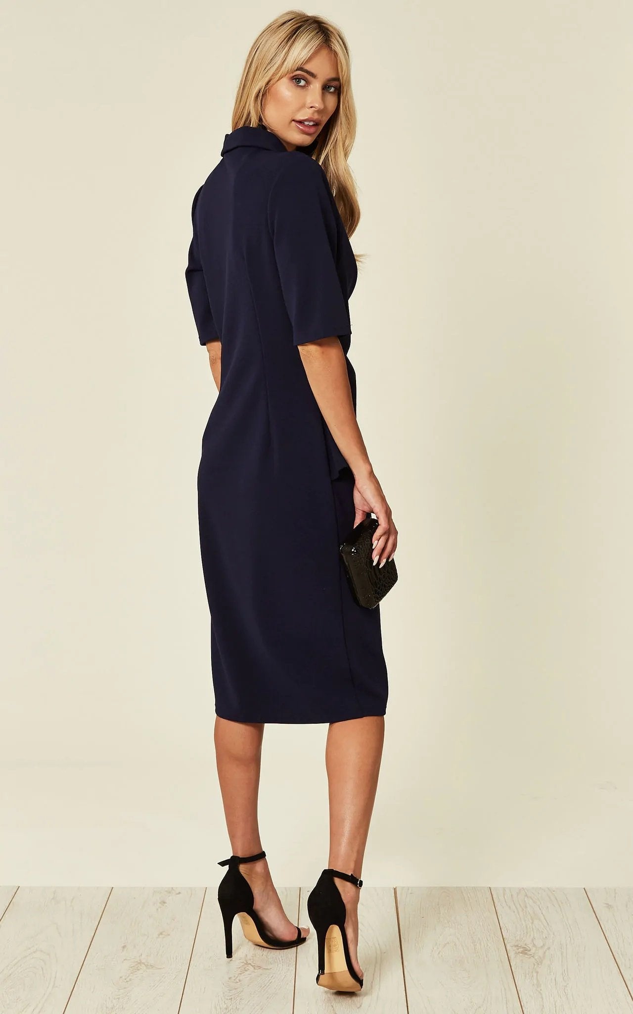 Navy Diane Wrap Blazer Dress by Rose Eleusis featuring a tailored fit and elegant wrap design, displayed on a model.