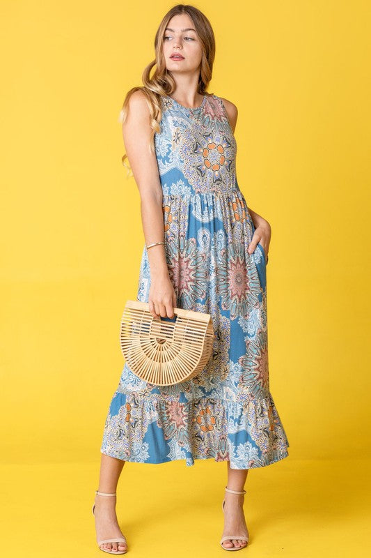 Jade Icarus sleeveless print tea-length dress with ruffled hem, perfect for casual summer wear, featuring colorful floral pattern.