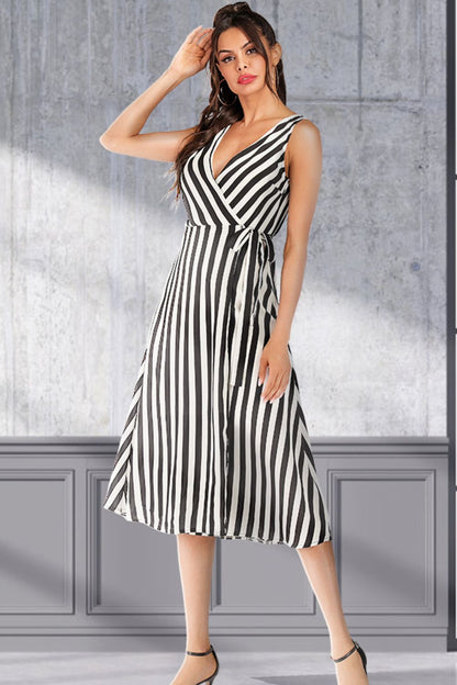 Pear Daisy striped surplice tied sleeveless dress with a fitted bodice and flowing skirt, perfect for casual home and garden wear.