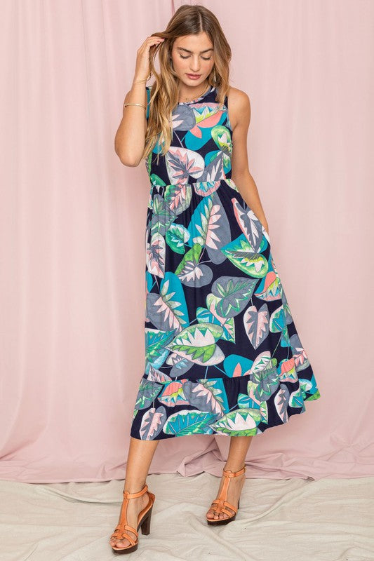 Jade Icarus sleeveless print tea-length dress with ruffled hem, feminine design, and vibrant floral pattern for women&