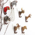 Fuchsia Molly animal wall hook mounted on a wooden wall, decorative home and garden accessory for hanging items.