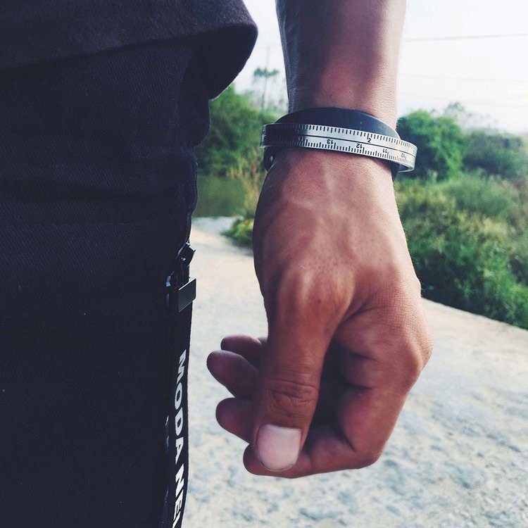 Fuchsia Molly ruler bracelet featuring a slim metal band with engraved measurement markings, stylish jewelry accessory.
