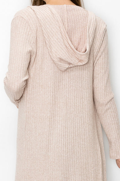 Beige long sleeve hooded light cardigan from Yellow Hera, styled as a casual dress, with soft fabric and relaxed fit.