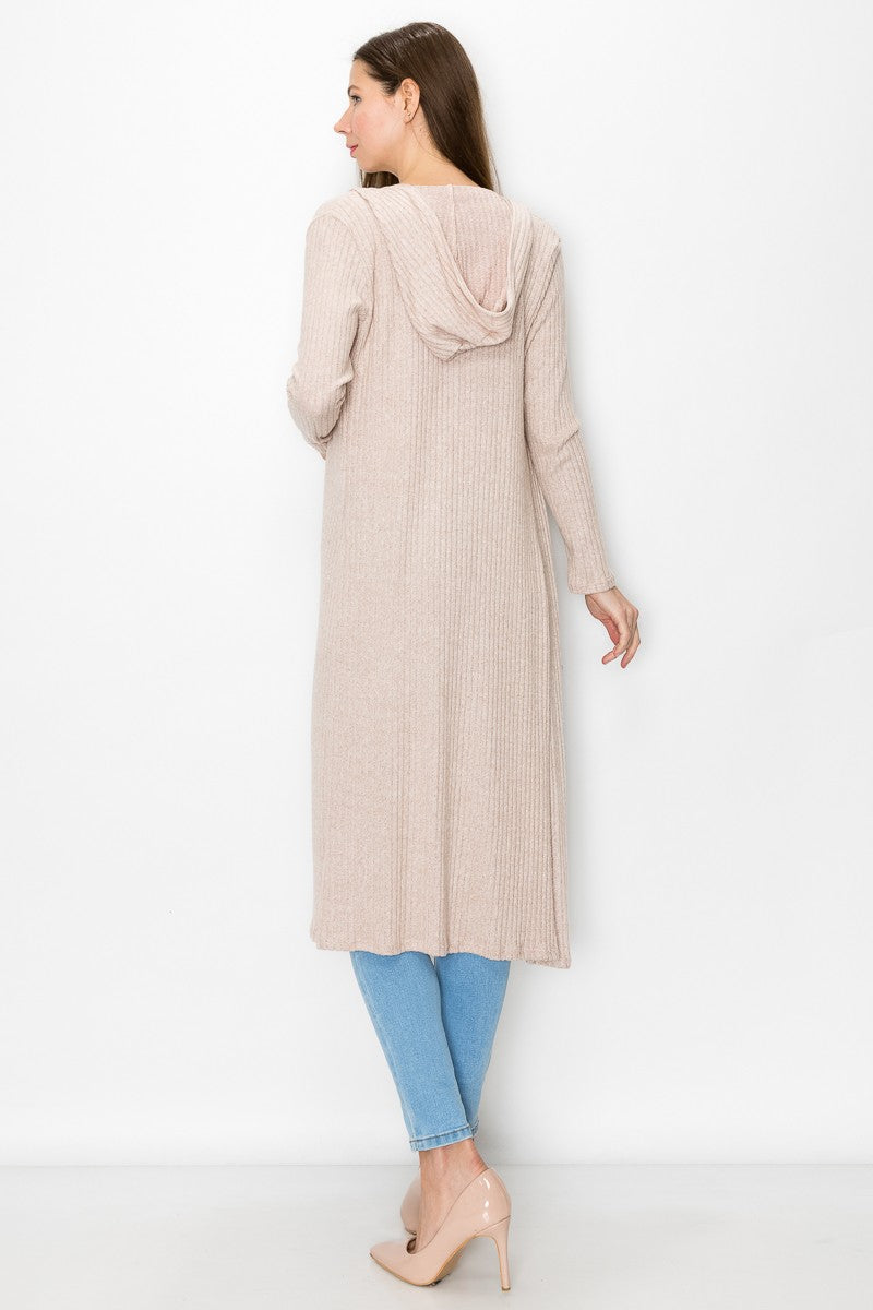 Beige long sleeve hooded light cardigan from Yellow Hera, styled as a dress, with a soft, cozy fabric and relaxed fit.