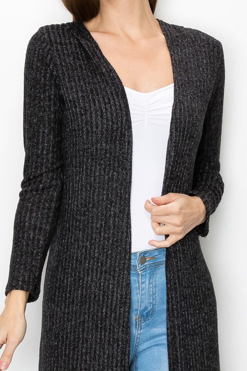 Black long sleeve hooded light cardigan from Yellow Hera, styled as a casual dress or layered over outfits.