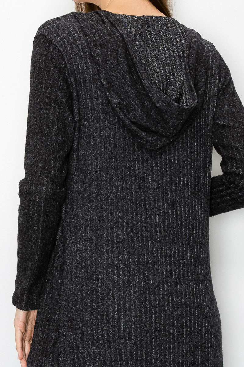 Black long sleeve hooded light cardigan from Yellow Hera, styled as a casual dress with a relaxed fit and soft fabric.