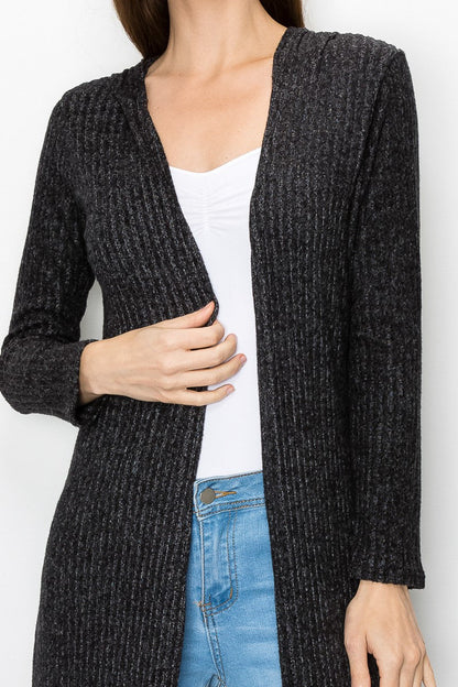 Black long sleeve hooded light cardigan dress by Yellow Hera, shown on a model with a relaxed fit and casual style.
