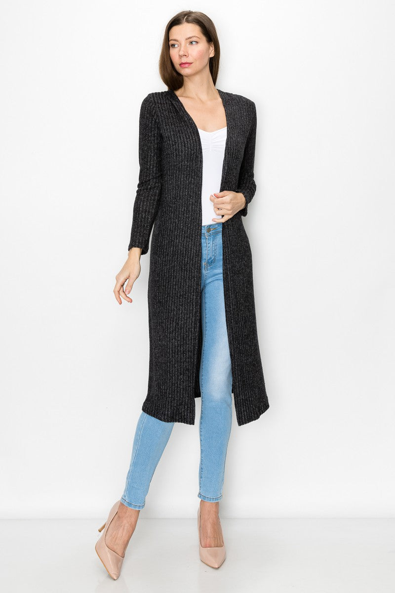 Black long sleeve hooded light cardigan dress by Yellow Hera displayed on a hanger with a casual fit and soft fabric texture.